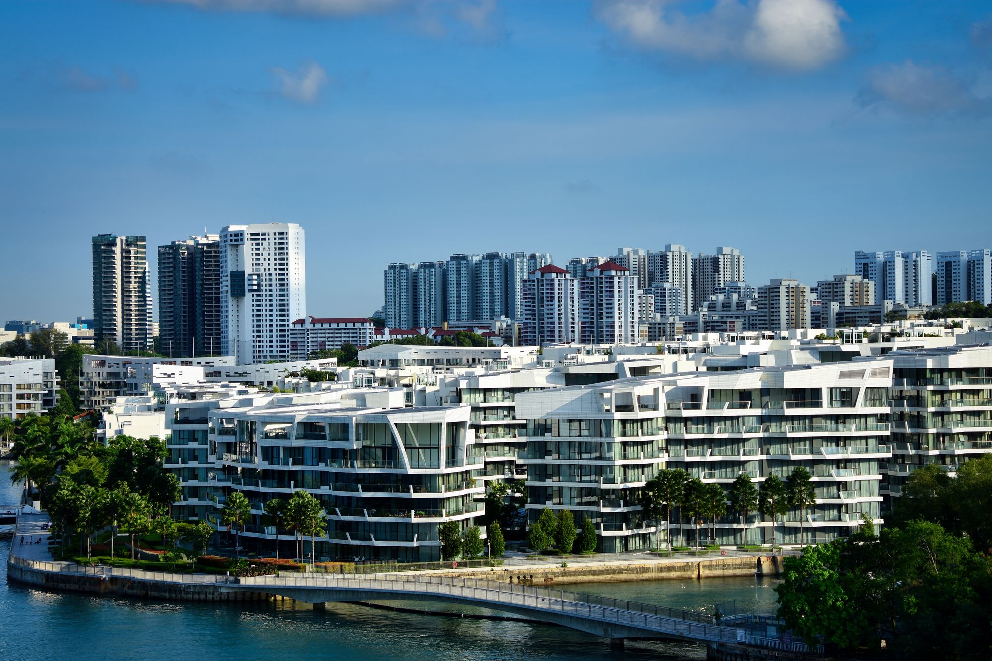 Modern waterfront condominium development in Singapore with high-rise residential towers behind