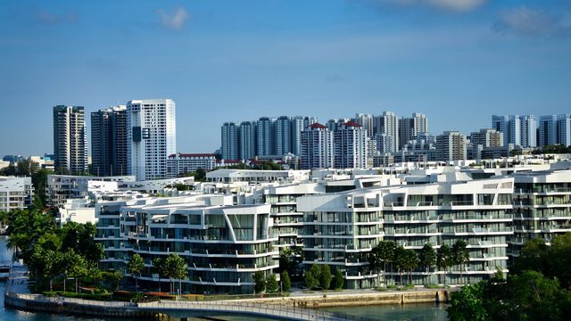 Modern waterfront condominium development in Singapore with high-rise residential towers behind